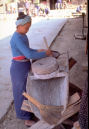 Dai Lady Grinding Grain