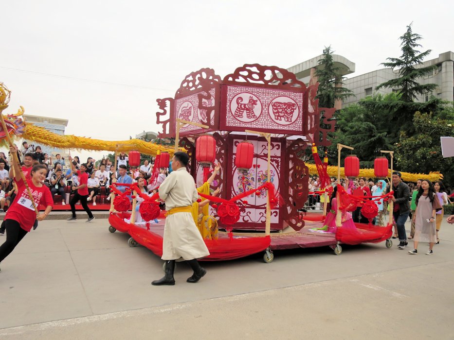 Lions Dance Around Float  