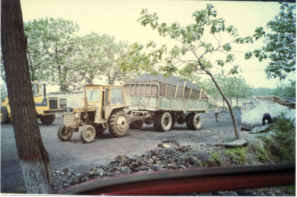Tractor Pulling Coal Trailer