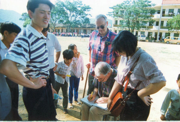 Larry Signs School Book