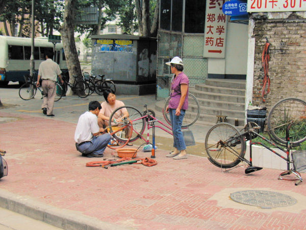 Street Bicycle Repairman