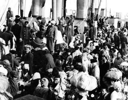 Refugees wait to board USS Meredith Victory