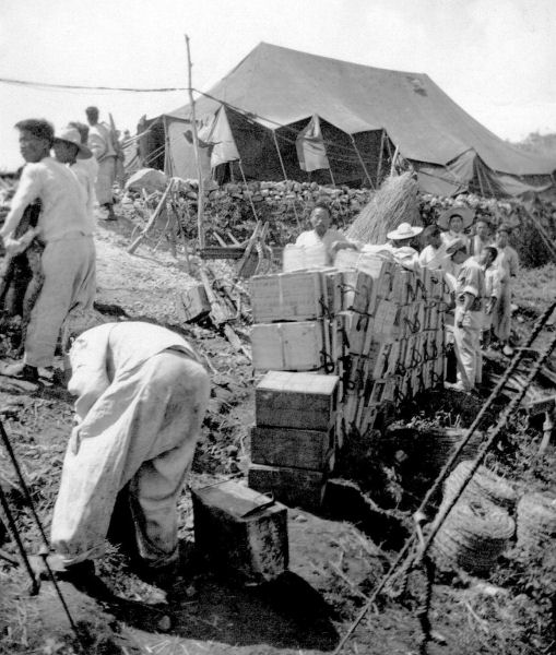 Unloading Supplies at 'Piggy San' Relay 