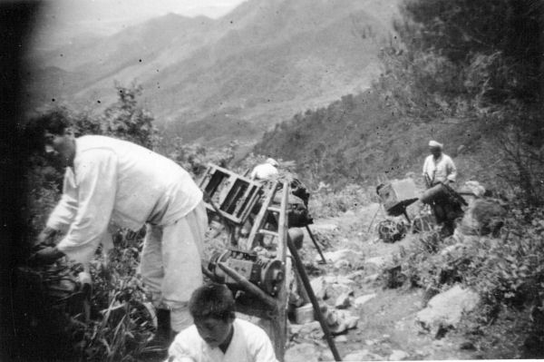 Korean Laborers Help Carry Equipment to the Top of 1157