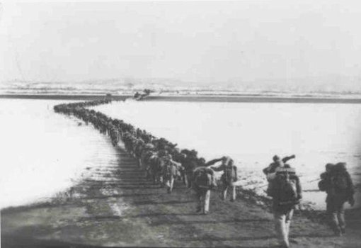 The Chinese Troops March Across the Yalu River into North Korea
