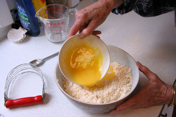 Step 14 -  Add Yolks to Flour Mixture 