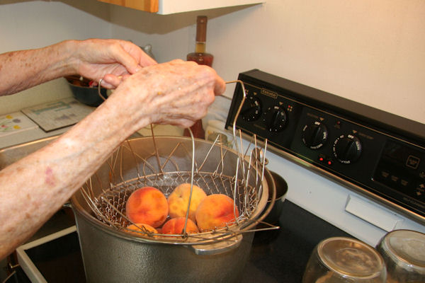 Step 2 - Dip Peaches in Boiling Water