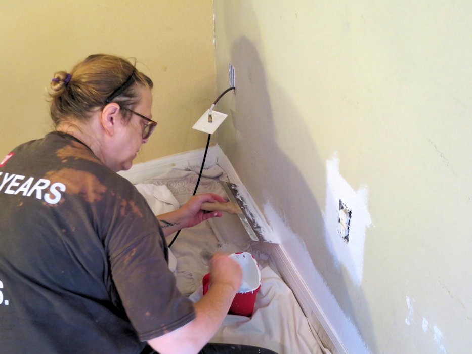 Area right of the Fireplace being Painted  