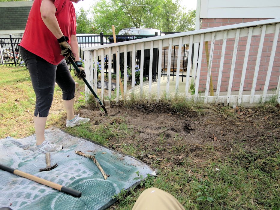 Sandy clears Weeds from Ramp Edge  