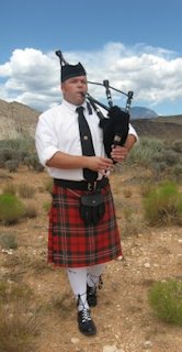 Bagpiper Playing the Bagpipes 